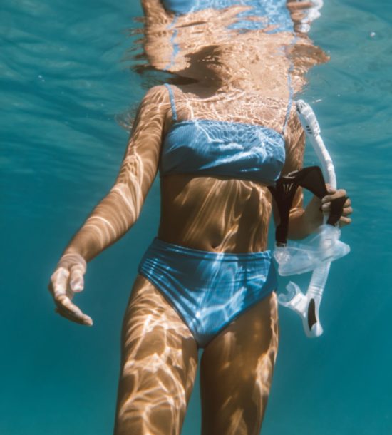 Elana snorkeling underwater in Maui, HI