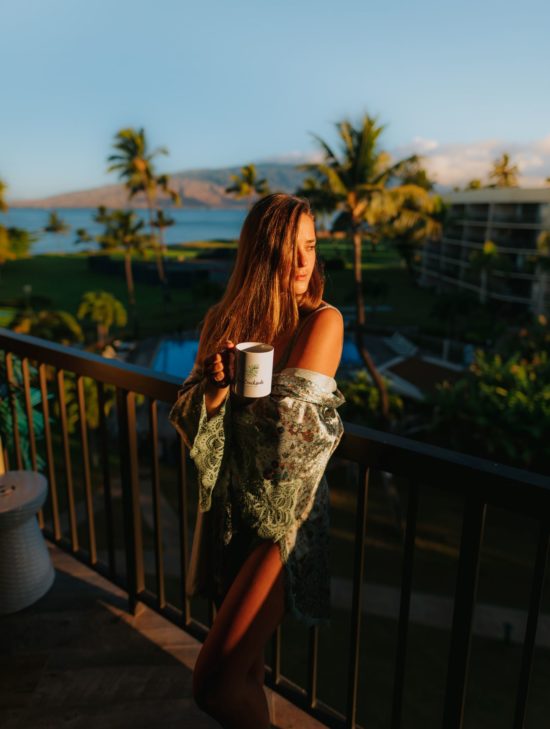 Nikki enjoying Maui Beachside patio in the morning with a cup of coffee.